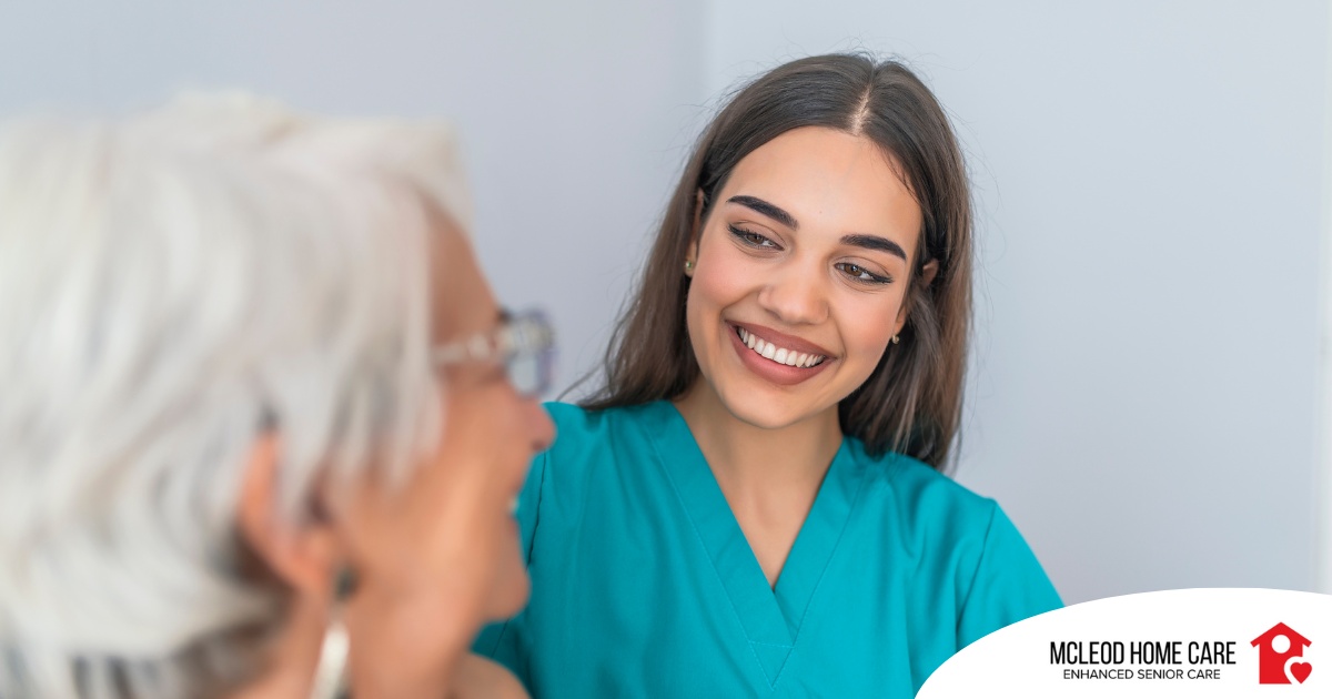 A caregiver smiles with an older client showing the results of successfully starting a new caregiving job.