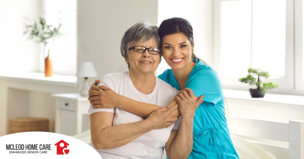 A caregiver hugs an older client, representing how a trustworthy caregiver cares for clients.