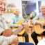A group of seniors enjoy playing instruments together showing the impact of music for older adults.