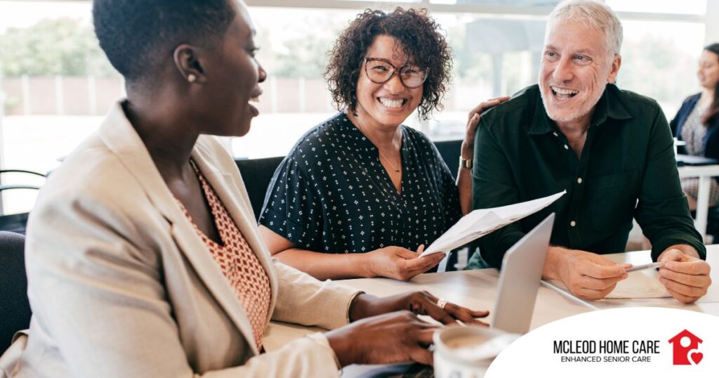 A couple talks with and advisor, representing the type of preparation that is crucial for successful senior care planning.