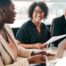 A couple talks with and advisor, representing the type of preparation that is crucial for successful senior care planning.